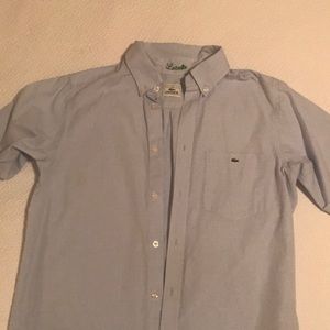 Short sleeve pale blue Lacoste button down shirt.